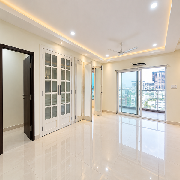 Modern living room, spacious apartment, contemporary interior, luxury home, elegant living space, glass balcony doors, large windows, glossy floor, premium apartment, modern ceiling, recessed lighting, warm LED lighting, decorative wall panels, white interior, neutral decor, stylish home, sophisticated interior, spacious hall, urban residence, luxury property, modern architecture, clean home design, polished tiles, ceiling fan, natural daylight, balcony access, bright apartment, minimalist decor, premium interiors, residential interior, modern Indian apartment, upscale living room, beautiful home, elegant wall molding, contemporary home design, spacious residential property, high-end interior, clean flooring, luxury lifestyle, modern lighting, refined home decor, stylish apartment interior, open floor plan, comfortable living area, premium residential design, modern real estate, elegant home setting, bright living space, contemporary property, luxury apartment design.